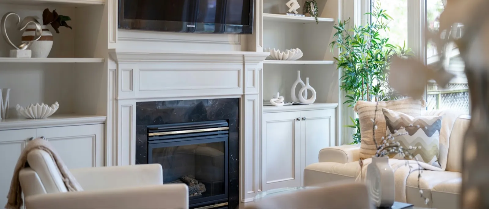 Fireplace with painted built-in cabinets and open shelves on both sides